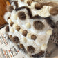 Cushion with recycled fur
