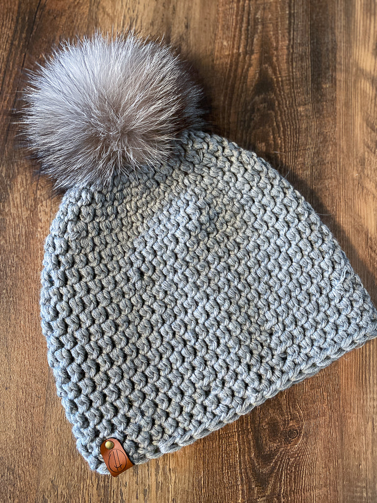 Merino beanie with recycled fur pompom